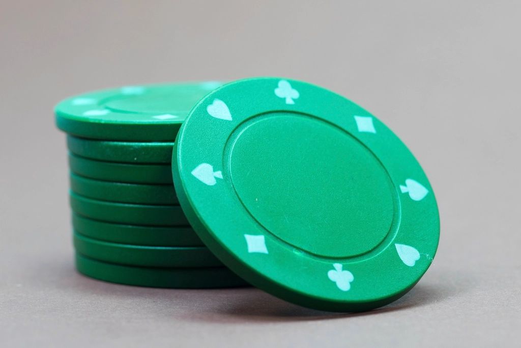 Gaming chips and cards on the table felt